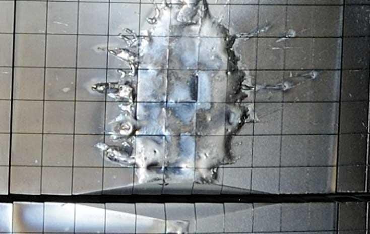 In-vessel photo of melted JET beryllium inner-wall limiter struck by a runaway electron beam